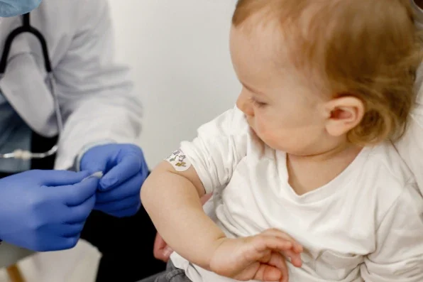 Vaccination, adult & baby photo